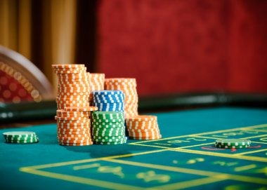 Live roulette table with dealer and multiple betting positions